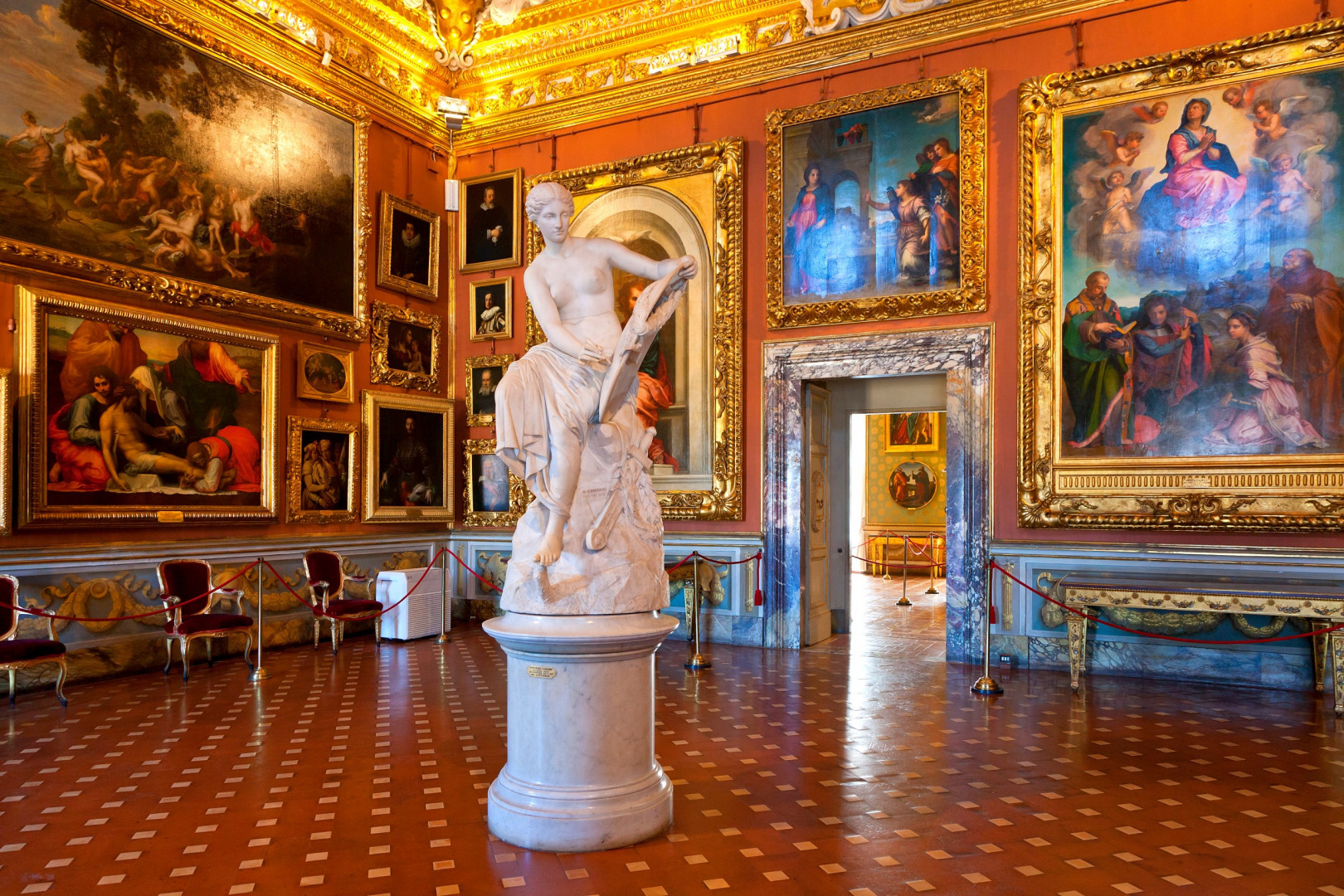 Luxurious room within Florence's Pitti Palace, showcasing exquisite art and design.