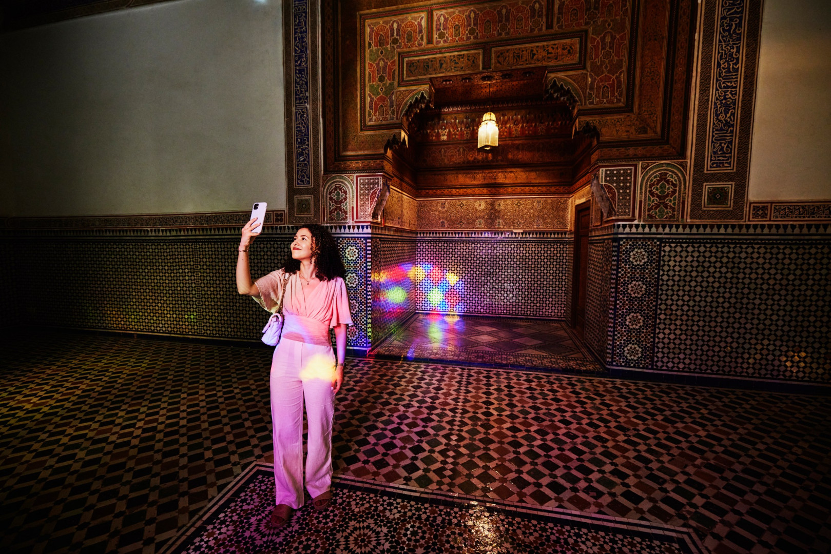A visitor takes a selfie at the Bahia Palace in Marrakesh, Morocco