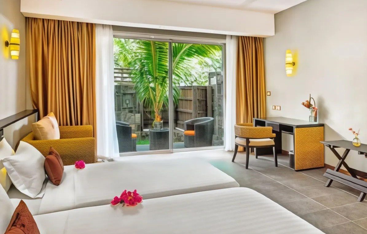 Interior of Dodola Lodge featuring twin beds and a private patio.
